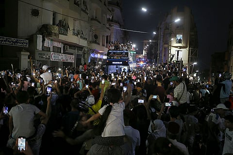 People gather in the streets in Tiaret, Algeria to welcome Algeria's Imane Khelif